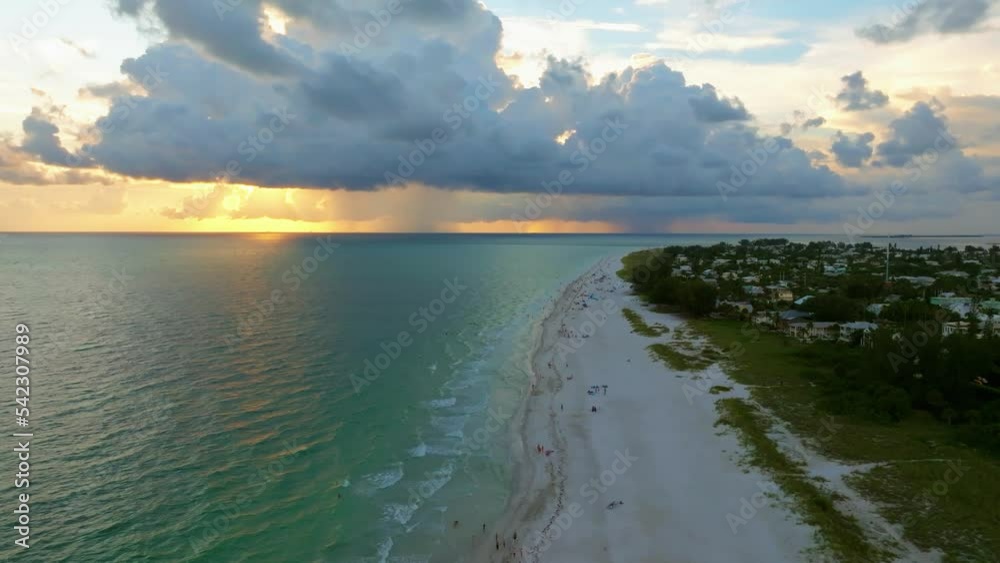 Aerial drone view of sunset over the Gulf of Mexico seen from Anna Maria Island, Florida.