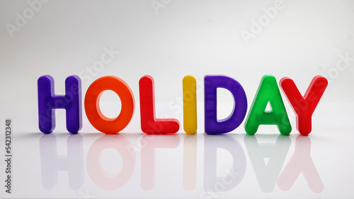 red green blue yellow plastic toy capital font letter alphabet holiday on white background copy text space concept