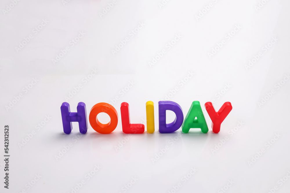 red green blue yellow plastic toy capital font letter alphabet holiday on white background copy text space concept red green blue yellow plastic toy capital font letter alphabet holiday on white background copy text space concept