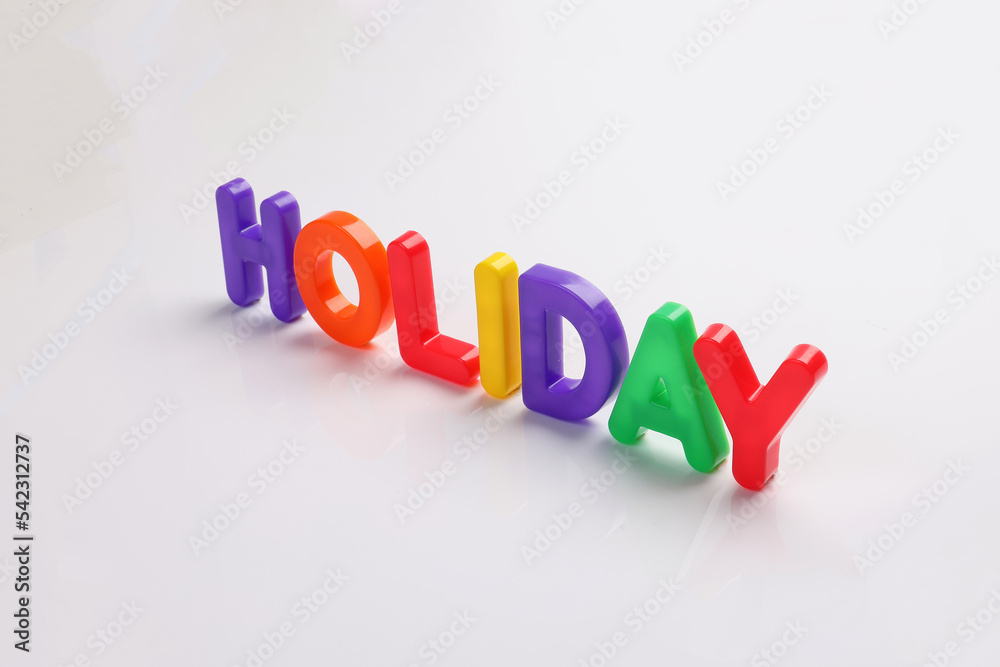 red green blue yellow plastic toy capital font letter alphabet holiday on white background copy text space concept red green blue yellow plastic toy capital font letter alphabet holiday on white background copy text space concept