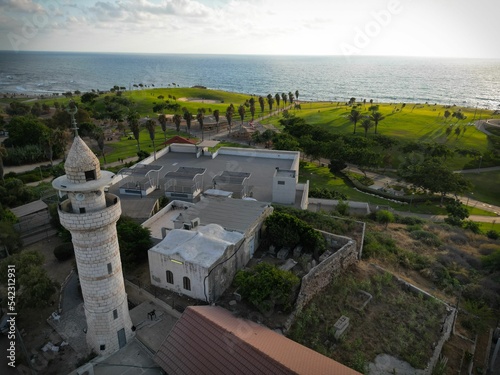 Aerial drone view of the Sidna Ali Mosque and a beautiful coast photo