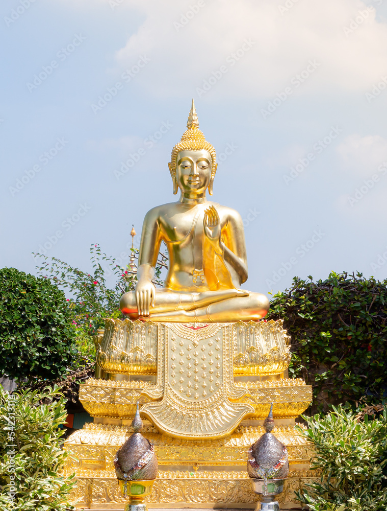 Beautiful golden Buddha statue against blue sky in Thai temple, Phetchabun province, Thailand Amazing Buddha statue with bright clouds in the sky.
