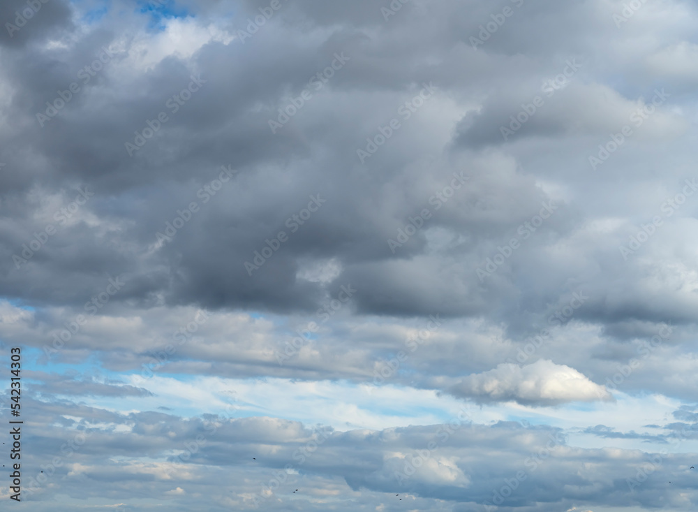 Silvery cloudy sky. Clouds in the blue sky Silvery cloudy sky. Clouds in the blue sky