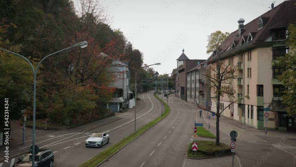 Autumn cityscape with car traffic and cyclists, 30.10.22. Freiburg, Germany Autumn cityscape with car traffic and cyclists, 30.10.22. Freiburg, Germany