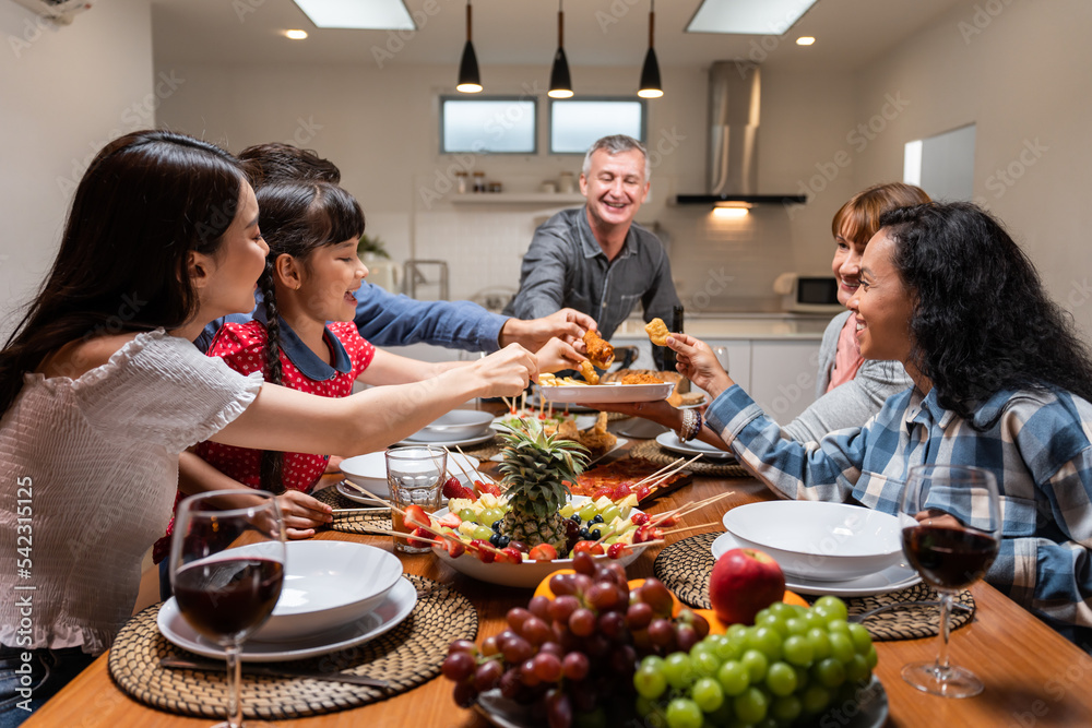 Big family having dinner, enjoy evening party in house. Big family having dinner, enjoy evening party in house.