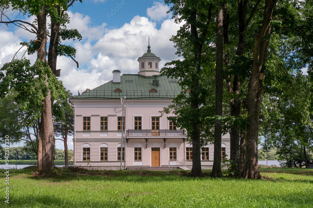View of the manor house with an outbuilding in the Novgorod Museum of Folk Wooden Architecture of Vitoslavlitsa on a sunny summer day, Veliky Novgorod, Russia