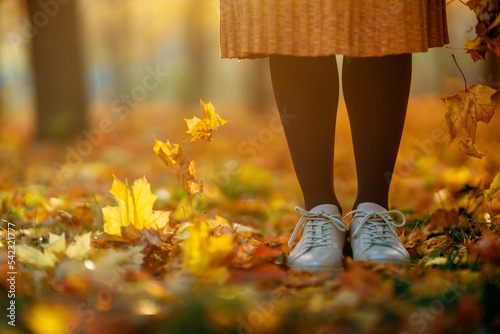 Woman is walking in the park.