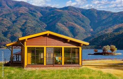 House near lake. Country co...