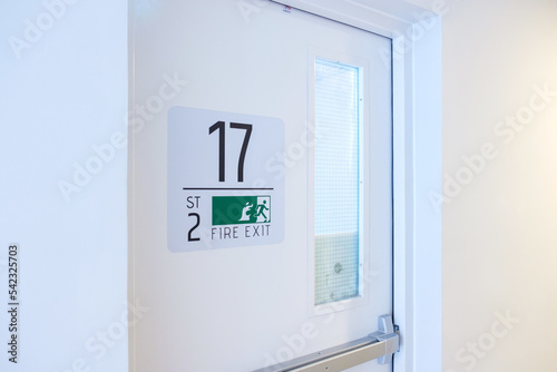 Wallpaper Mural Fire Exit door sign for emergency. Stairwell fire for escape in building or apartment Torontodigital.ca