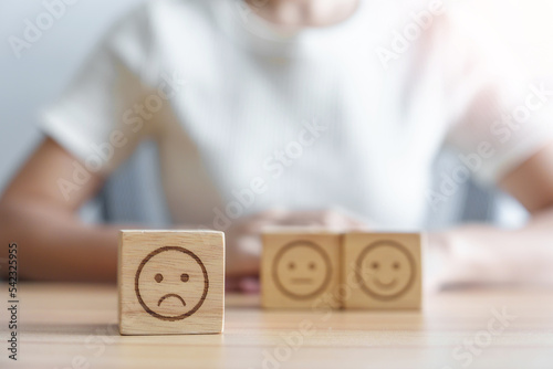 unhappy angry face from Emotion block. customer review, bad experience, negative feedback, satisfaction, survey, rating service, assessment, mood, world mental health day concept photo