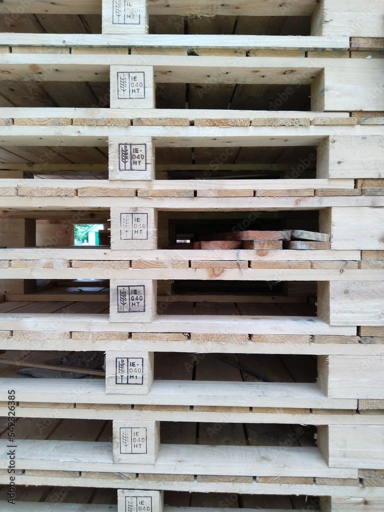 pile of wooden pallets. Wooden pallets have many uses, including for storing goods, stacking, and protecting goods that will be sent or moved by Forklift. pile of wooden pallets. Wooden pallets have many uses, including for storing goods, stacking, and protecting goods that will be sent or moved by Forklift.