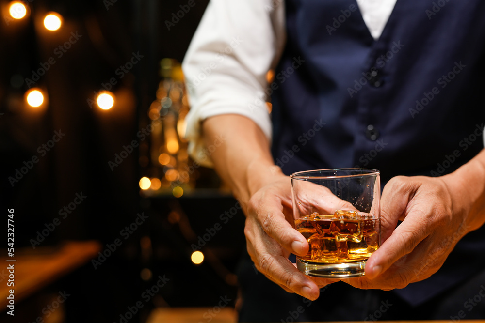 Bartender pouring Whiskey, on bar, Bartender pouring Whiskey, on bar,
