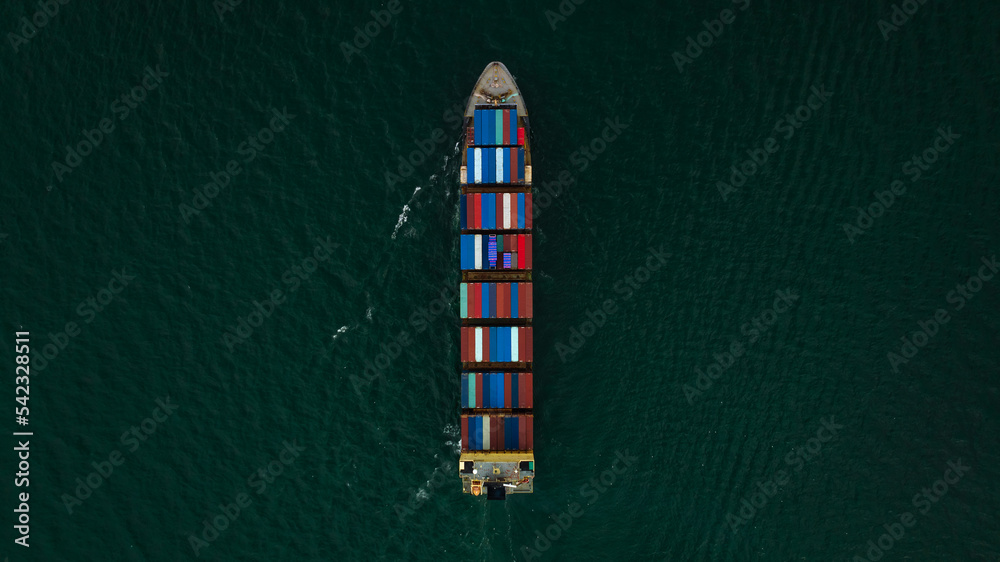 Container ship carrying container for import and export international in sea aerial top view photograph from drone Container ship carrying container for import and export international in sea aerial top view photograph from drone