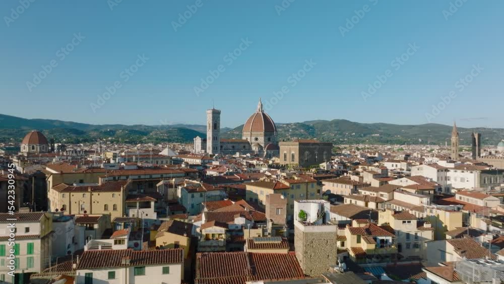 Low flight above buildings in old town, heading towards well known Duomo di Firenze. Famous cathedral with large cupola. Florence, Italy Low flight above buildings in old town, heading towards well known Duomo di Firenze. Famous cathedral with large cupola. Florence, Italy