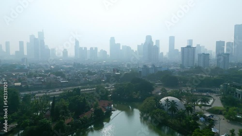 Air pollution covering Jakarta cityscape at morning photo