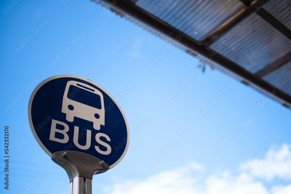 Fototapeta premium Bus stop under the blue sky.