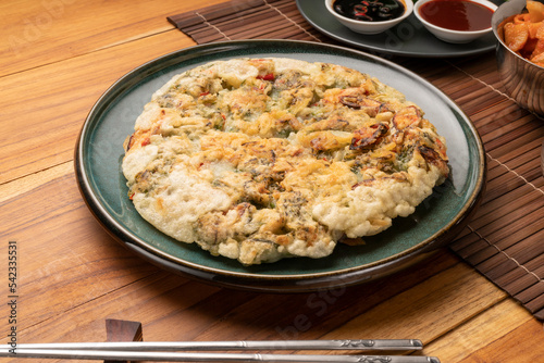 Korean pancake or Pajeon, Korean  dish made from egg and wheat flour with chili and chives vegetable.