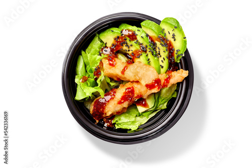 Japanese salad with lettuce, avocado and shrimps tempura dressed with mirin sauce and black sesame photo