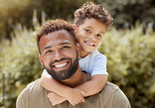 Portrait, happy father and boy smile in garden fun, vacation and break in summer happiness together. Black man and child smile, love and hug outdoor bonding free time on a sunny day in the park #542338182