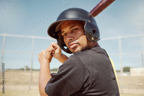 Sports portrait of athlete baseball player with bat for power strike, hit or swing in club competition, game or practice match. Softball motivation, winner mindset and man ready for field training photo