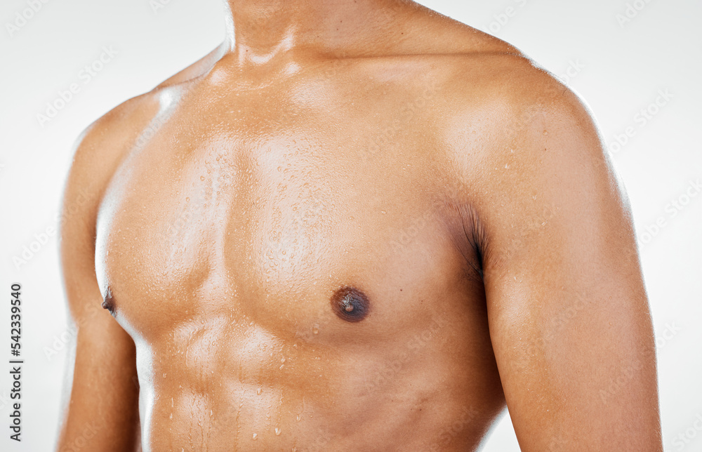 Fototapeta premium Fitness, man and chest in studio closeup for health, wellness and muscle against a white background with mockup. Stomach, skincare and guy model torso for six pack, beauty and grooming with mock up