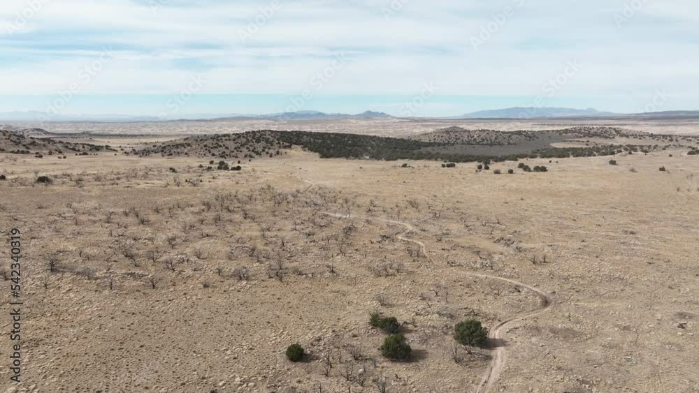 Aerial Utah desert dusty trail motorcycle race. Extreme desert motocross in rural desert community. Championship competition and fun. Sport recreation family fun and entertainment. Powerful bikes. Aerial Utah desert dusty trail motorcycle race. Extreme desert motocross in rural desert community. Championship competition and fun. Sport recreation family fun and entertainment. Powerful bikes.