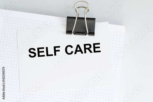 Self care text on card on white background. Healthcare concept. Stay home stay safe concept.