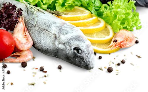 Raw fresh fish with lemon isolated on white table