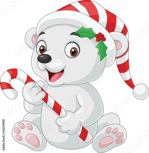 Cute baby polar bear holding candy cane