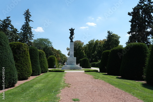 beautiful landscapes erected statue holding arrow