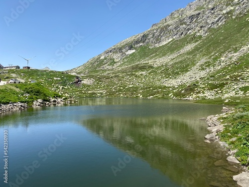 Summer atmosphere on the Lago dei Morti or Lake of the Dead (Totensee) in the Swiss alpine area of mountain St. Gotthard Pass (Gotthardpass), Airolo - Canton of Ticino (Tessin), Switzerland (Schweiz)