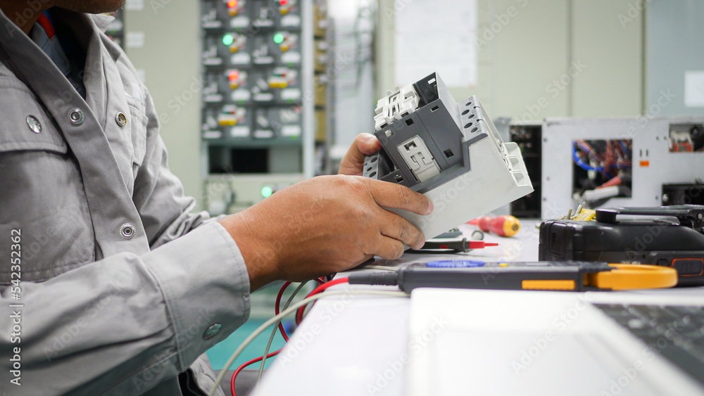 Engineer to check and repair electrical components, industrial technology and engineering concept