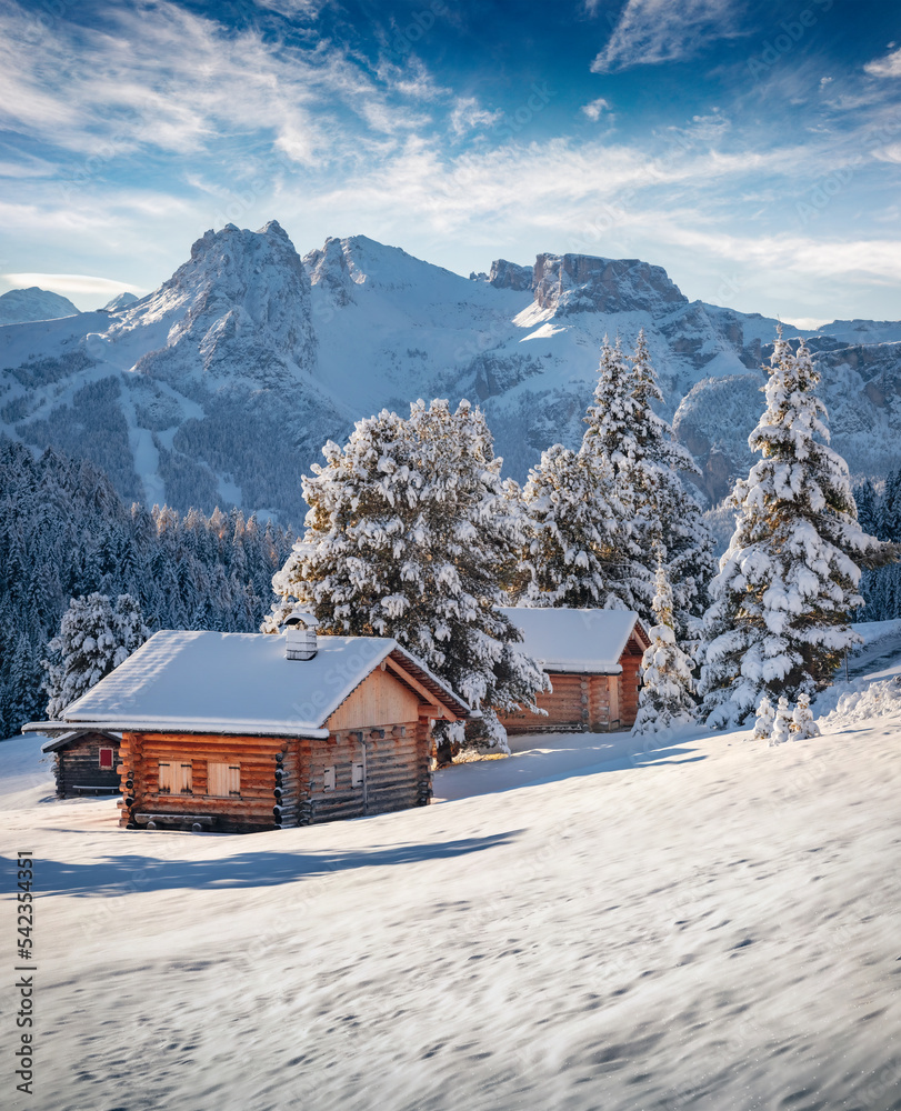 Gorgeous morning view of Alpe di Siusi village. Stunning winter landscape of Dolomite Alps. Majestic outdoor scene of ski resort, Ityaly, Europe. Beauty of nature concept background.