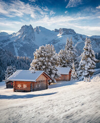 Gorgeous morning view of Alpe di Siusi village. Stunning winter landscape of Dolomite Alps. Majestic outdoor scene of ski resort, Ityaly, Europe. Beauty of nature concept background.