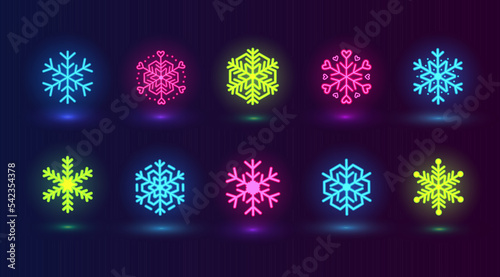 Vector set with neon colorful snowflakes. Winter pink, blue, green icons on dark blue background.
