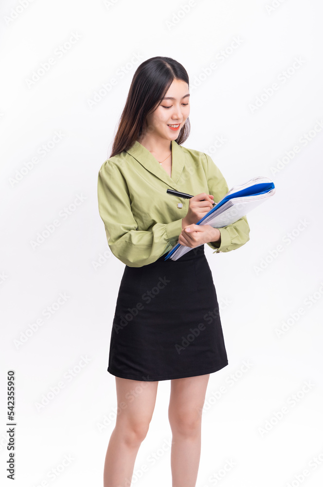 Business woman with a green suit and a black skirt and a folder on a white background Business woman with a green suit and a black skirt and a folder on a white background