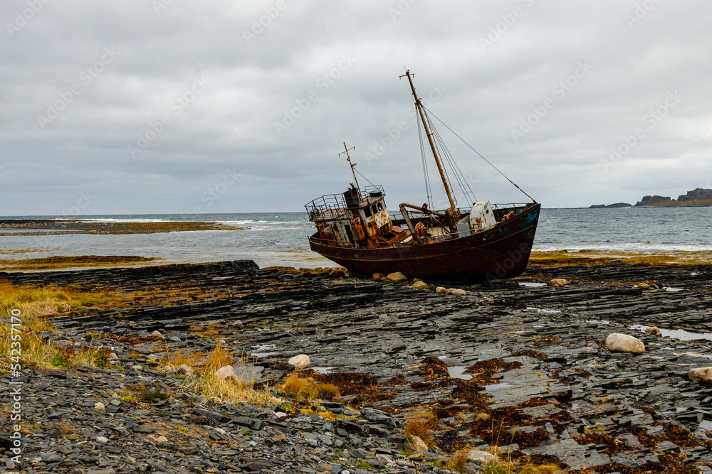 Abandoned old ship on the coast of the Arctic Ocean. Cape Nemetskiy (Rybachiy Peninsula), Russia.
