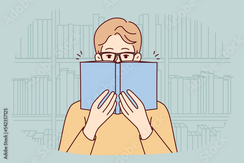 Man in glasses reading book in library. Happy guy in eyewear enjoy literature in bookshop. Education and learning. Vector illustration. 