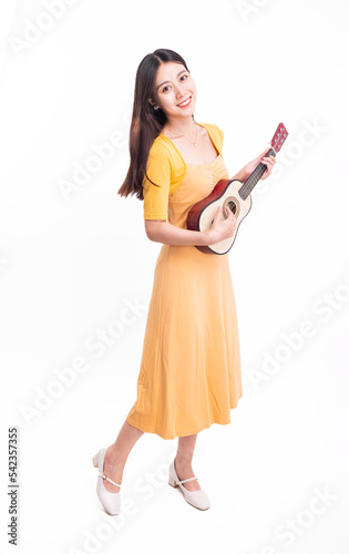 The girl in the yellow dress with the ukulele