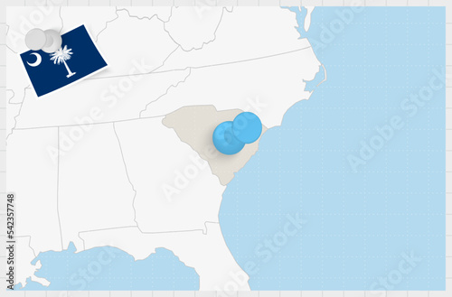Map of South Carolina with a pinned blue pin. Pinned flag of South Carolina.