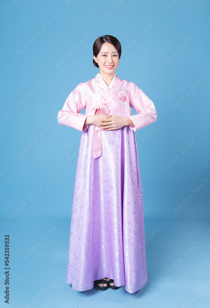 Image of young Korean woman wearing hanbok on background Image of young Korean woman wearing hanbok on background