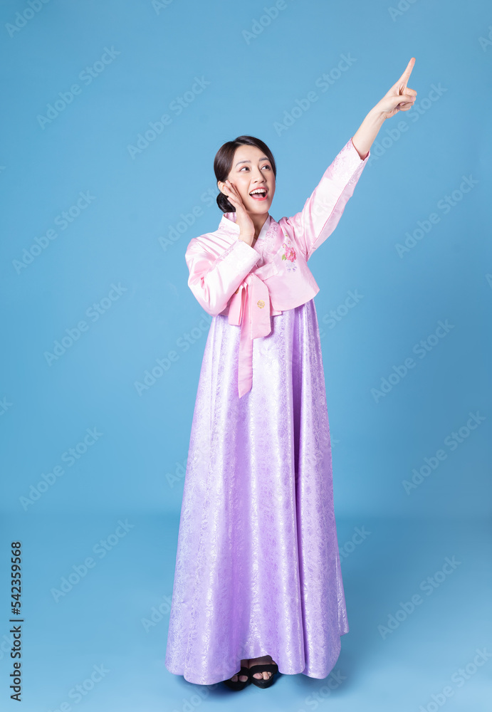 Image of young Korean woman wearing hanbok on background Image of young Korean woman wearing hanbok on background