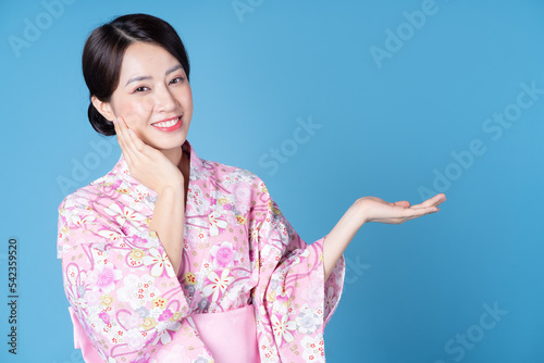 Image of young Japanese woman wearing kimono photo