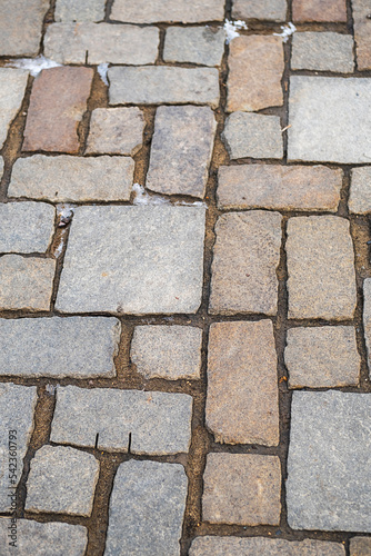 Road paving slabs pattern. Way paved with stones.