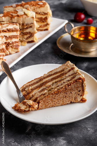 Almond cake. Piece of Cake on a Plate. Sweet food. Sweet dessert. Food background.