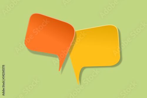 orange and yellow speech bubble paper cut on green background. Conceptual image about communication and social media, customer feedback