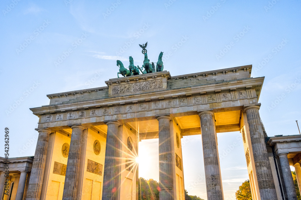 The famous Brandenburg Gate in Berlin with the last sun rays before sunset