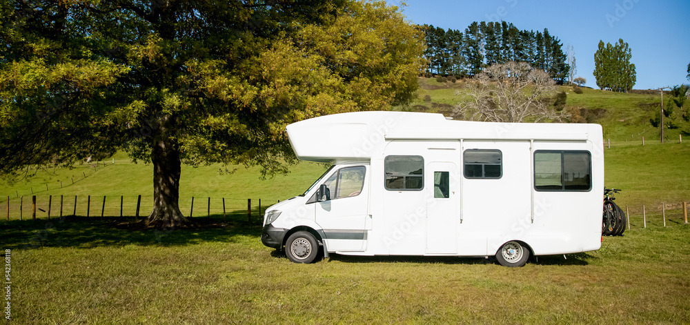 motorhome, caravan or campervan on natural background, vanlife concept, road trip idea. High quality photo