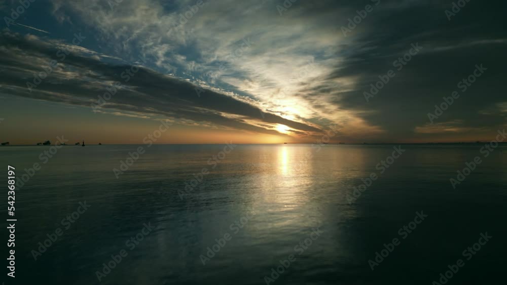 Aerial low flight: Scenic sunset on Baltic Sea in Poland. Dron flying above the water. Aerial low flight: Scenic sunset on Baltic Sea in Poland. Dron flying above the water.