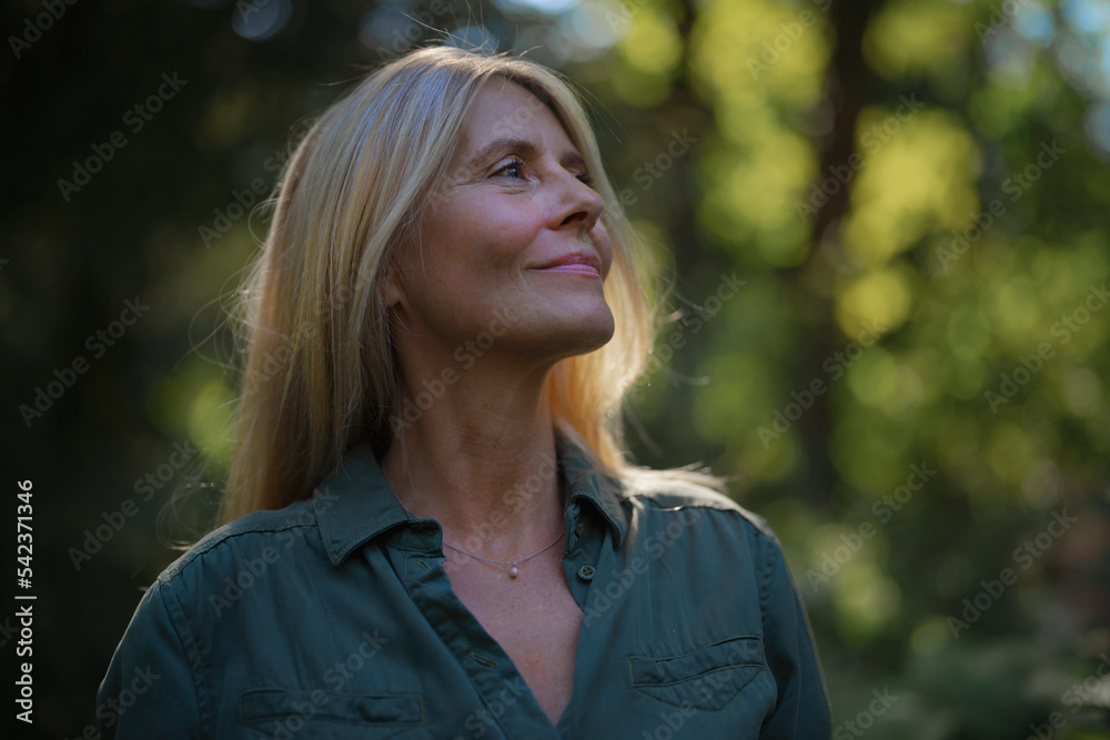 Smiling mature woman in garden Smiling mature woman in garden